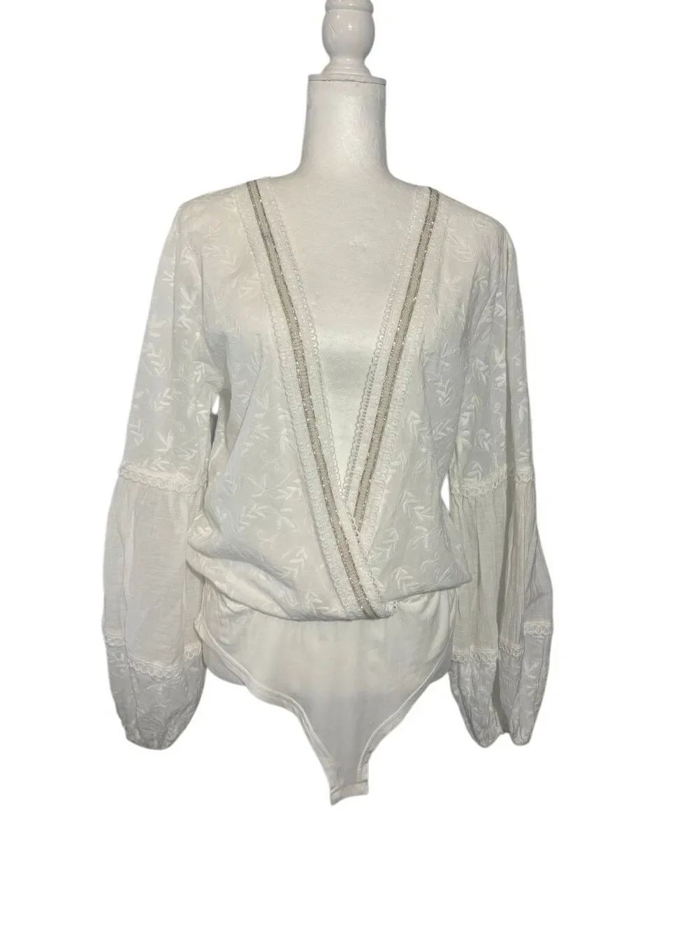 NWOT POL Lost Girl white wrap body suit with floral embroidery and rhinestone tr